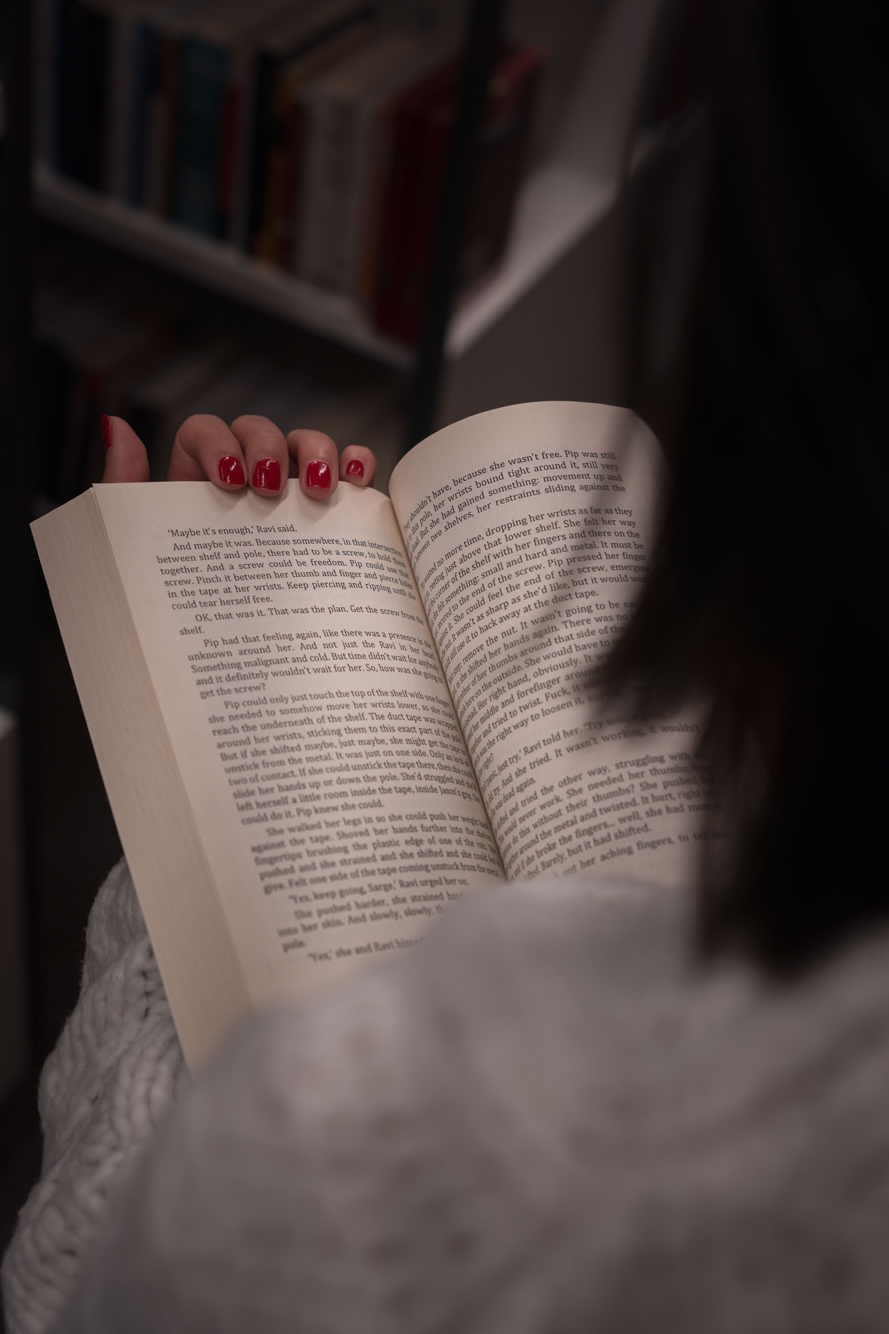 Woman reading an open book.