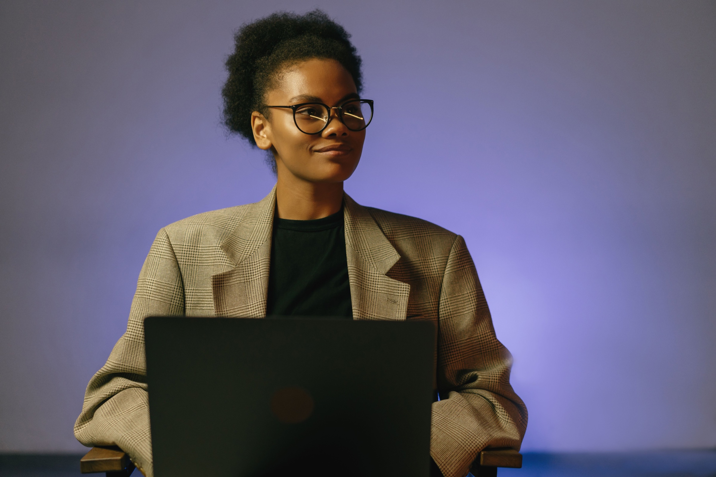 Professional woman working at a laptop.